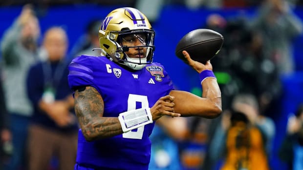 Washington Huskies quarterback Michael Penix Jr. throws the football against the Texas Longhorns in the Sugar Bowl.